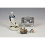 A collection of Royal Copenhagen porcelain collectables to include an Elephant Gate advertising pin
