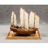 A hand built wooden model of a Chinese junk made in Thailand by The Miniature Shipyard