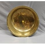 A brass bachin with decorated rim 24¼in. (61.5cm.) diameter.