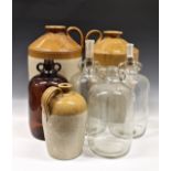 A collection of stoneware flagons and glass jars the largest flagon by 'Price of Bristol', 17½in.