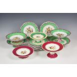 A mid-19th century Staffordshire part dessert service painted with fruit within apple green borders