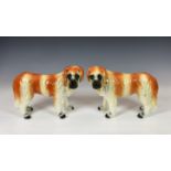 A pair of Scottish Bo'ness pottery St Bernards dogs with glass eyes and gilt collars, 12½in. (31.