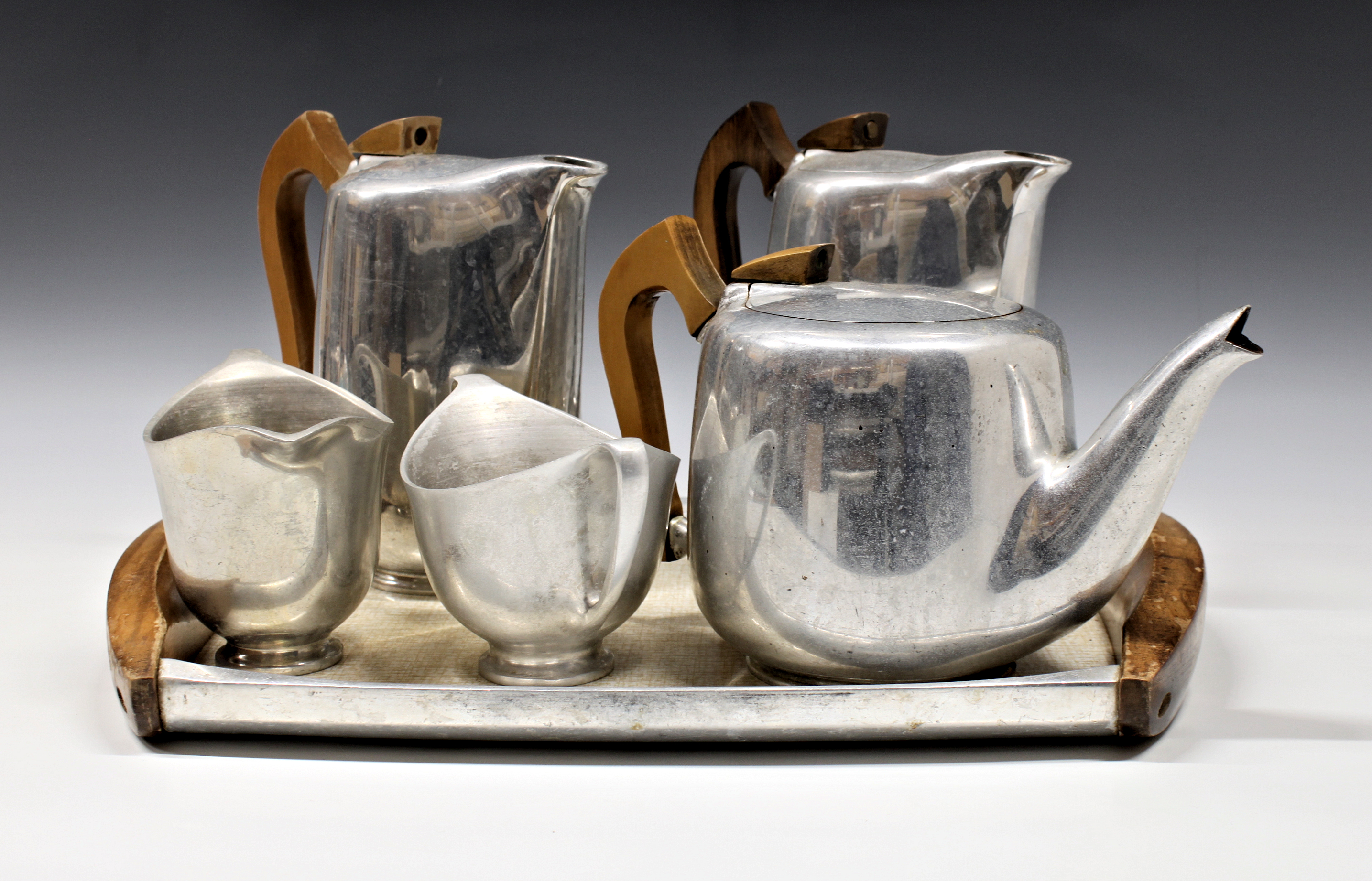 A mid-century Picquot Ware four piece tea and coffee service and tray