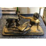 An Art Deco bronze painted plaster sculpture1930s, after Ugo Cipriani, of a recumbent female and a