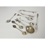 A collection of novelty and unusual silver cutlery comprising a teaspoon with roundel depicting ten