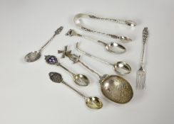 A collection of novelty and unusual silver cutlery comprising a teaspoon with roundel depicting ten