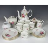 An Oakley fine bone china part tea service plus similar pieces of floral pattern decoration