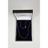 A 17½in. lapis lazuli bead necklace with silver clasp.