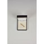 A 9ct gold and three cultured pearl bar brooch