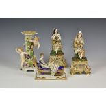 A pair of Continental porcelain figures early 20th century, of a huntsman and a maiden, seated upon