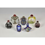 A collection of seven 20th century and earlier Chinese cloisonné and glass snuff bottles of varying