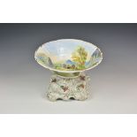 A large Victorian pottery pedestal bowl the flared bowl painted to the interior and exterior