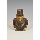 A reproduction cast iron 'TRANSVAAL' money box in the form of a caricatured President Kruger with