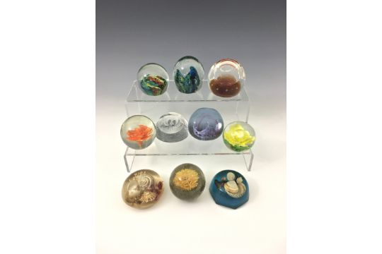 Seven glass paperweights to include Caithness 'Celebration' & 'Pebble