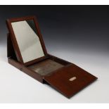 A 19th century mahogany cased campaign mirror opening to reveal rectangular mirror plate,