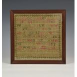 A William IV needlework alphabet sampler dated 1831, other lettering to signature panel indistinct,