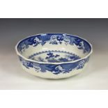 A Mason's Ironstone blue & white willow pattern wash bowl of large shaped circular form, transfer