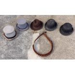 A collection of riding hats and whips to include a homemade birch carriage whip; riding crop;