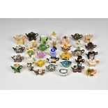 A collection of 34 boxed miniature teapots by Cardew.