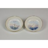 A pair of Royal Worcester porcelain pin dishes painted with yachts in the style of Raymond Rushton,