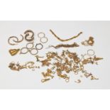 A collection of 9ct gold and above ex-shop stock butterflies; bearings; clips; jump rings; chains