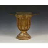 A French 19th century giltwood campana urn, mounted as an occasional table with a circular glass