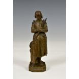 A bronzed spelter figure of Joan of Arc stamped 'DSR', 8 3/8in. (21.3cm.) high.