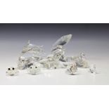 A collection of Swarovski figures to include A pair od Dolphins; "Care for Me" Whales; "Mother and