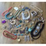 A large collection of vintage costume jewelleryto include necklaces, earrings, rings, brooches