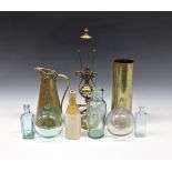 A collection of brassware and glass to include Art Nouveau brass jug; shell case; glass floats;