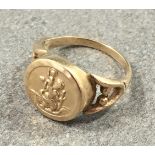 A 9ct yellow gold St. Christopher style ring, size L.