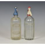 Two vintage Guernsey soda syphons, one etched 'E. & W. Guppy' and with 'Guppy's of Guernsey Soda