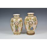 A pair of 20th century Japanese crackle glaze earthenware vases of ovoid form with figures in relief