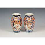 A pair of Japanese Imari vases early 20th century, tapered ovoid form, painted in the typical