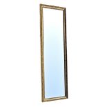 A modern rectangular gilt framed dressing mirror with bevelled glass, 47½ x 11½in. (120.5 x 29.