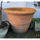 A large terracotta planter of mammoth proportions, 38in. (96.5cm.) diameter, 28in. (71cm.) high.