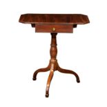 A late-Regency mahogany dropflap work table, the rectangular top with clipped corners, over a single