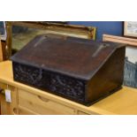 A late 17th century oak bible box, the slope front with iron strap hinge and lock plate over a