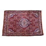 A Kashan style rug, second half 20th century, the madder field with all over floral, boteh and