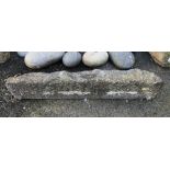 An antique carved granite lintel, 42in. long.