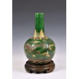 A Chinese Sancai glazed dragon bottle vase, 20th century, having elongated cylindrical neck to