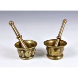 Two polished bronze Eastern pestle and mortar, each of similar typical form, the body with cast