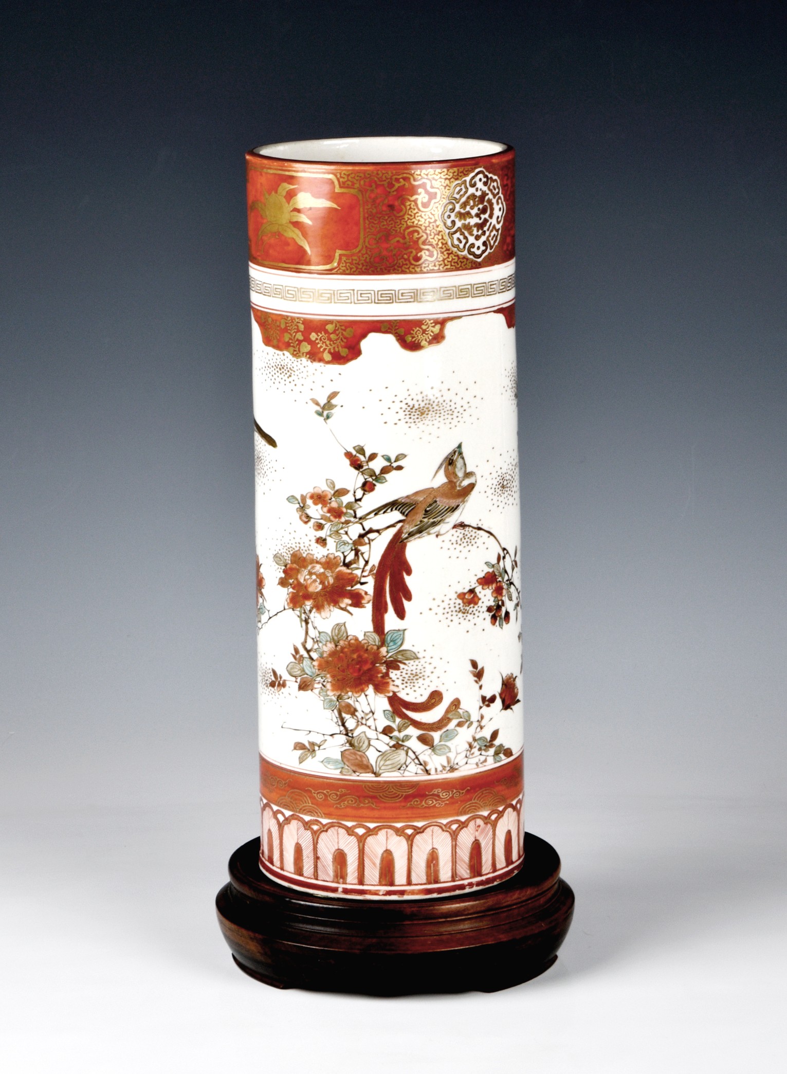 A Japanese Kutani sleeve vase, late 19th / early 20th century, painted with birds amidst branches of