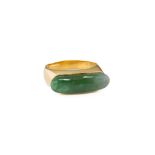 A modernist 18ct yellow gold and jade ring, 1970s-80s, the high, flat-topped shank with a single,