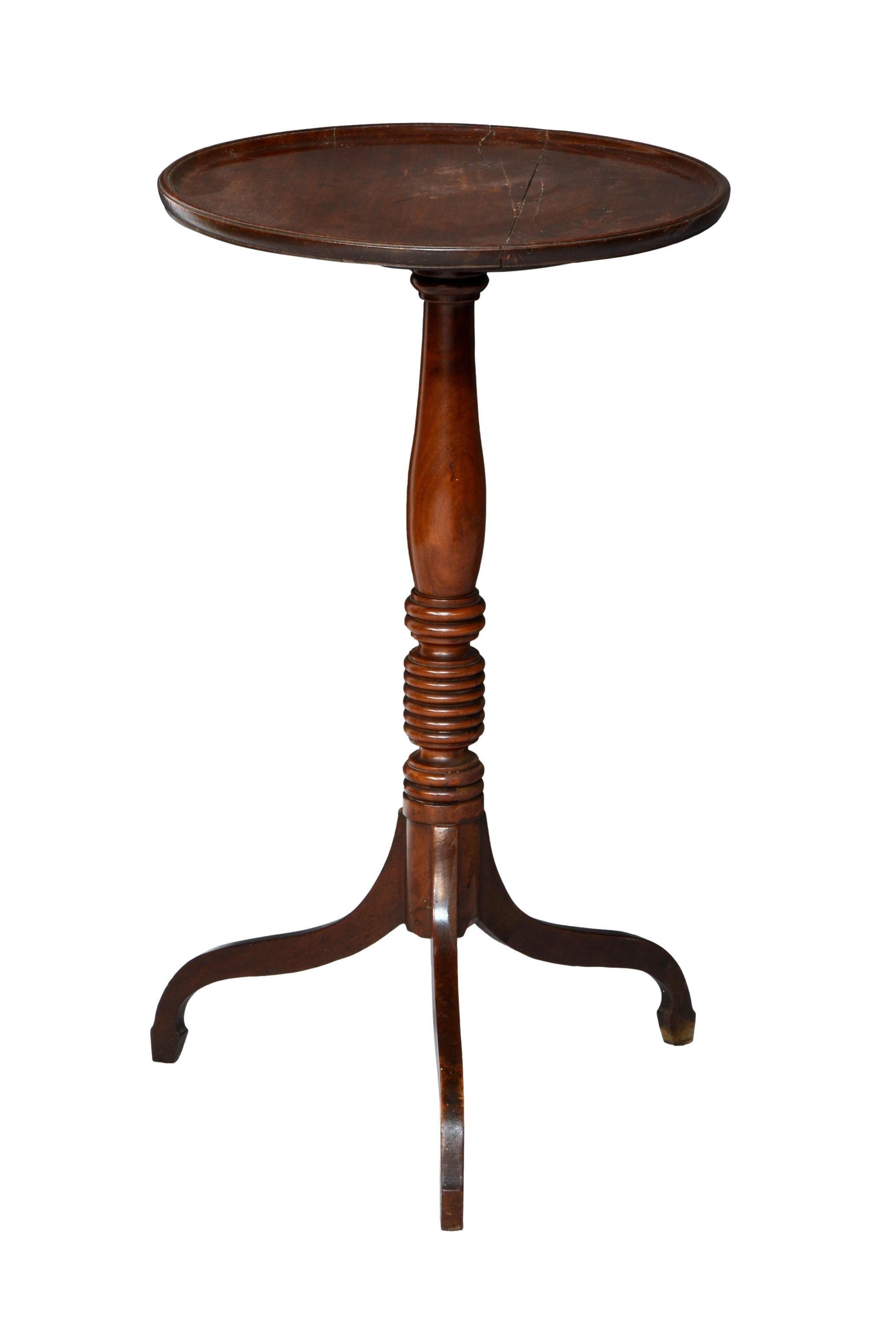 A 19th century mahogany tripod table, with dished circular top, on a ring turned column to swept