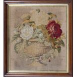 A Victorian petit point needlework, of roses in a stone urn, 17 x 15in. (43.2 x 38cm.), within a