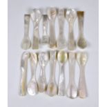 A small collection of Mother of Pearl spoons, of varying forms and sizes, together with a knife. (