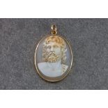 A shell cameo pendant, featuring a portrait of a bearded man in the Hellenistic style, within a