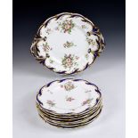 A 19th century English porcelain part dessert service, comprising a large twin handled serving