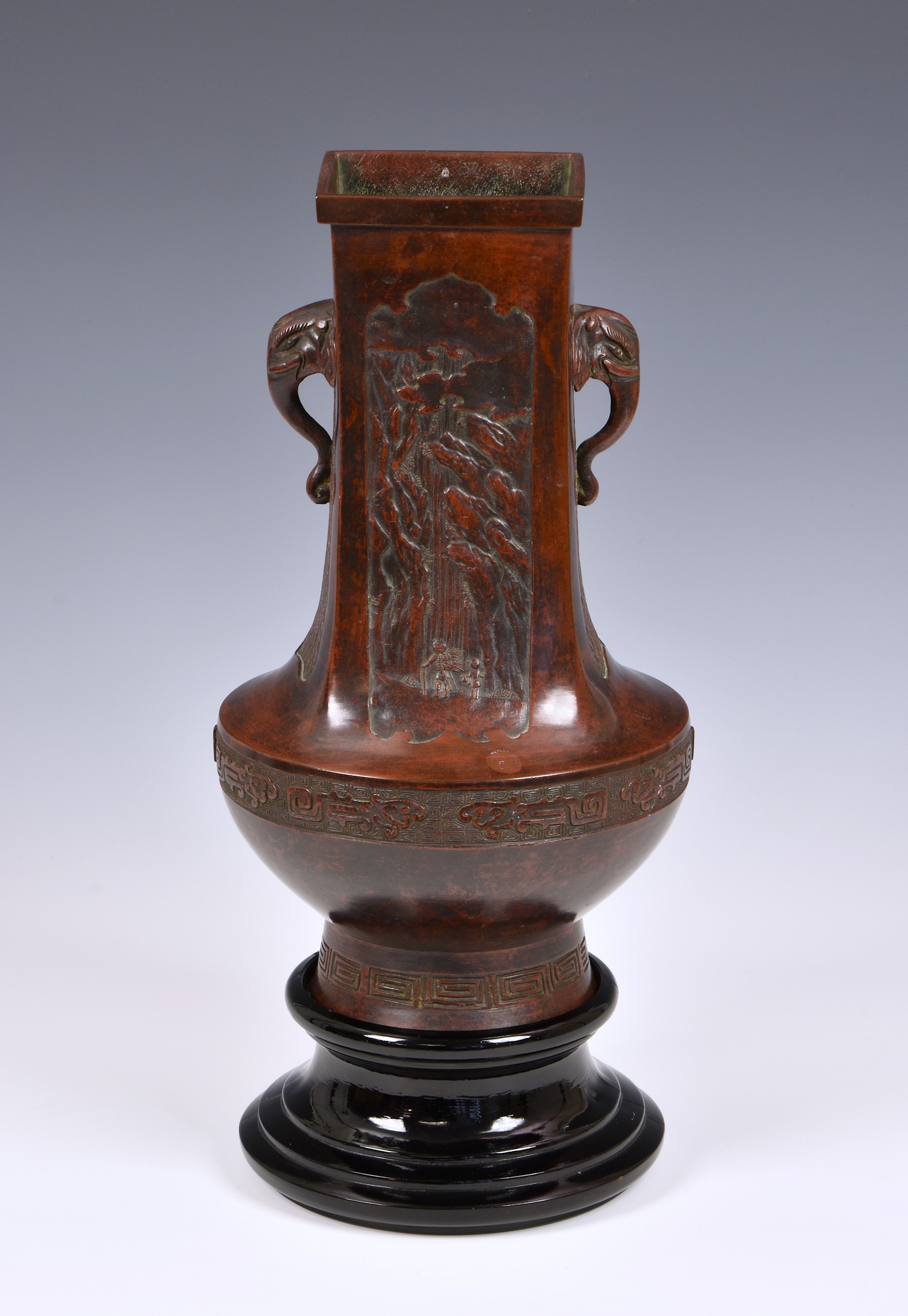 A Chinese patinated bronze two handled hu vase, probably 18th/19th century, with apocryphal Xuande